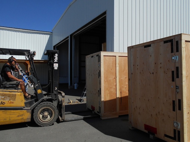 Once all the bugs are out of the system, it takes about 30 minutes to assemble a GOBOX. Here's Shane moving a GOBOX to the last part of the assemble line.